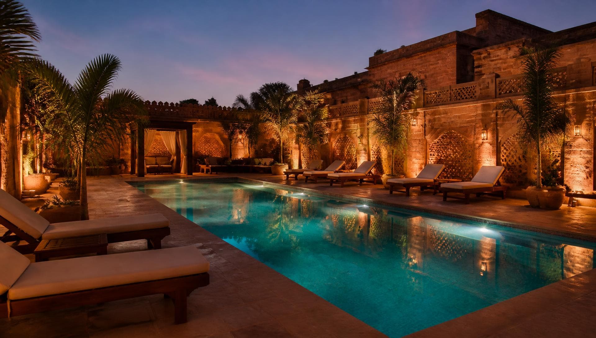 Outdoor swimming pool at Hotel Brick and Basalt in Udaipur